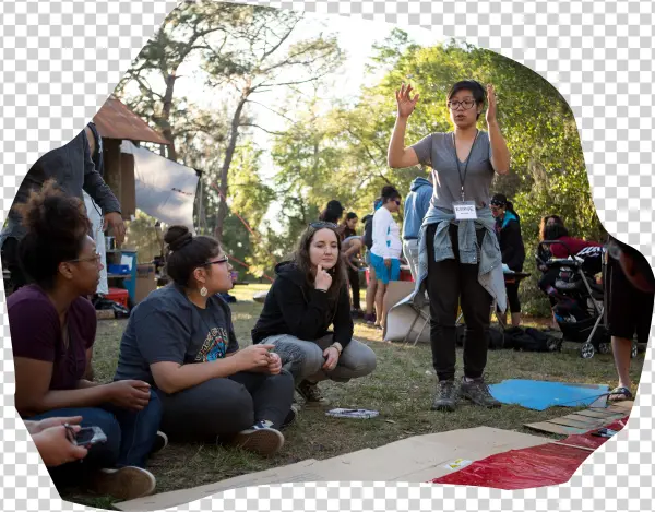 A Group Of Students Sitting In A Circle During A Workshop